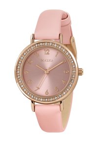 Montre ronde avec un boîtier en acier rose doré, un cadran métallique rose et des accents en cristal. Elle est équipée d'un bracelet en cuir rose clair.