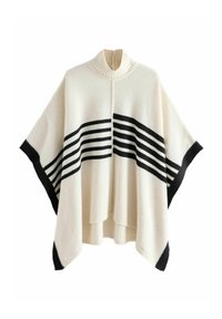 Poncho de punto en lana color crema con un cuello alto. Presenta franjas horizontales en blanco y negro en el pecho y bordes en negro sólido.