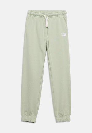 Pantalon de survêtement vert clair avec taille et poignets élastiques, cordon blanc, poches latérales et petit logo blanc sur la cuisse gauche.