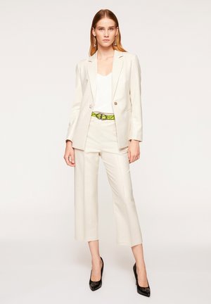 REGULAR - Trousers - panna