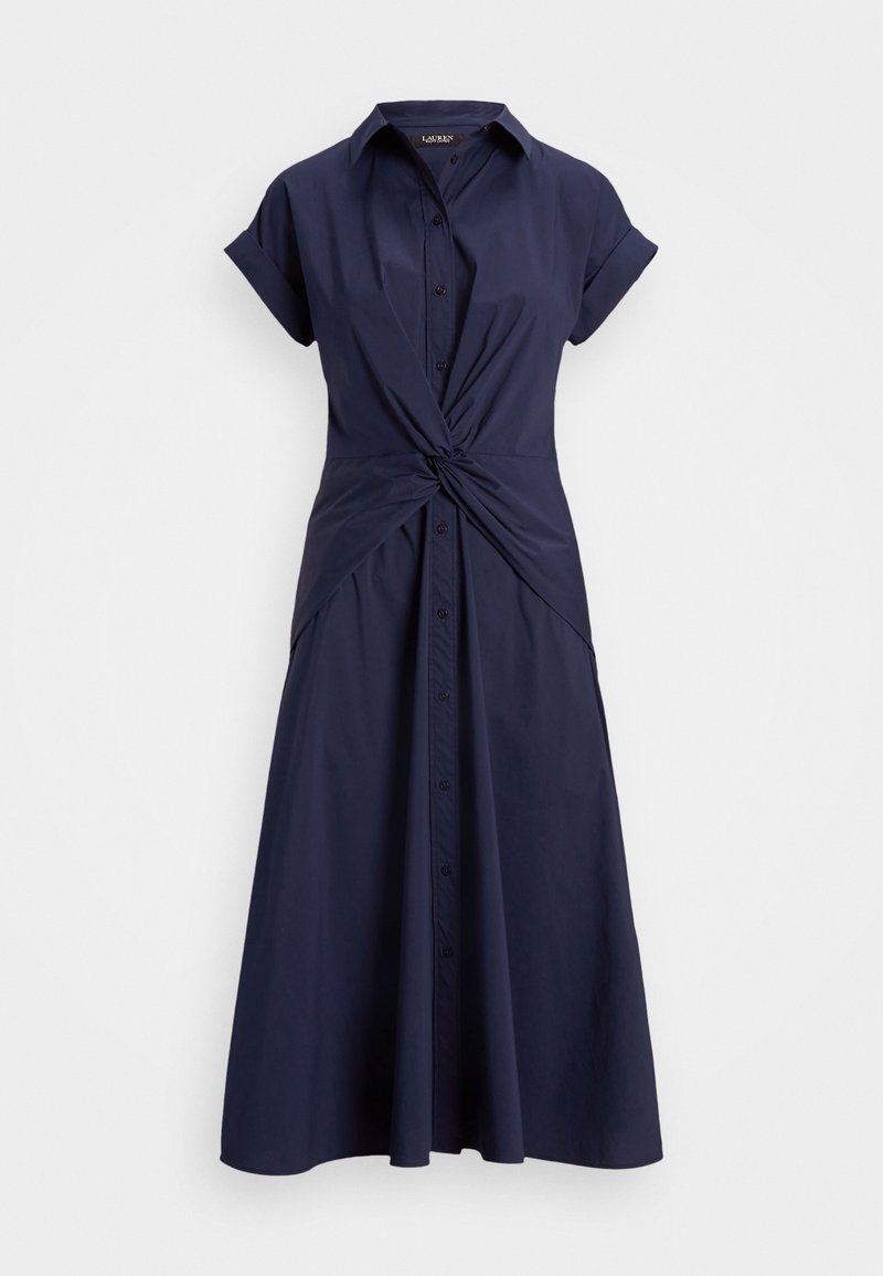 Navy button-up dress with short sleeves, twist detail at the waist, and a flowing, A-line skirt. Made of lightweight fabric.