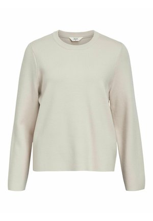 Maglione a maniche lunghe color beige chiaro con colletto rotondo. Realizzato in materiale a maglia testurizzata, presenta spalle leggermente cadute e una vestibilità rilassata.
