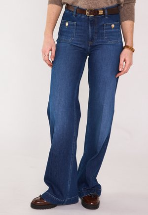 Jeans a zampa - stone used