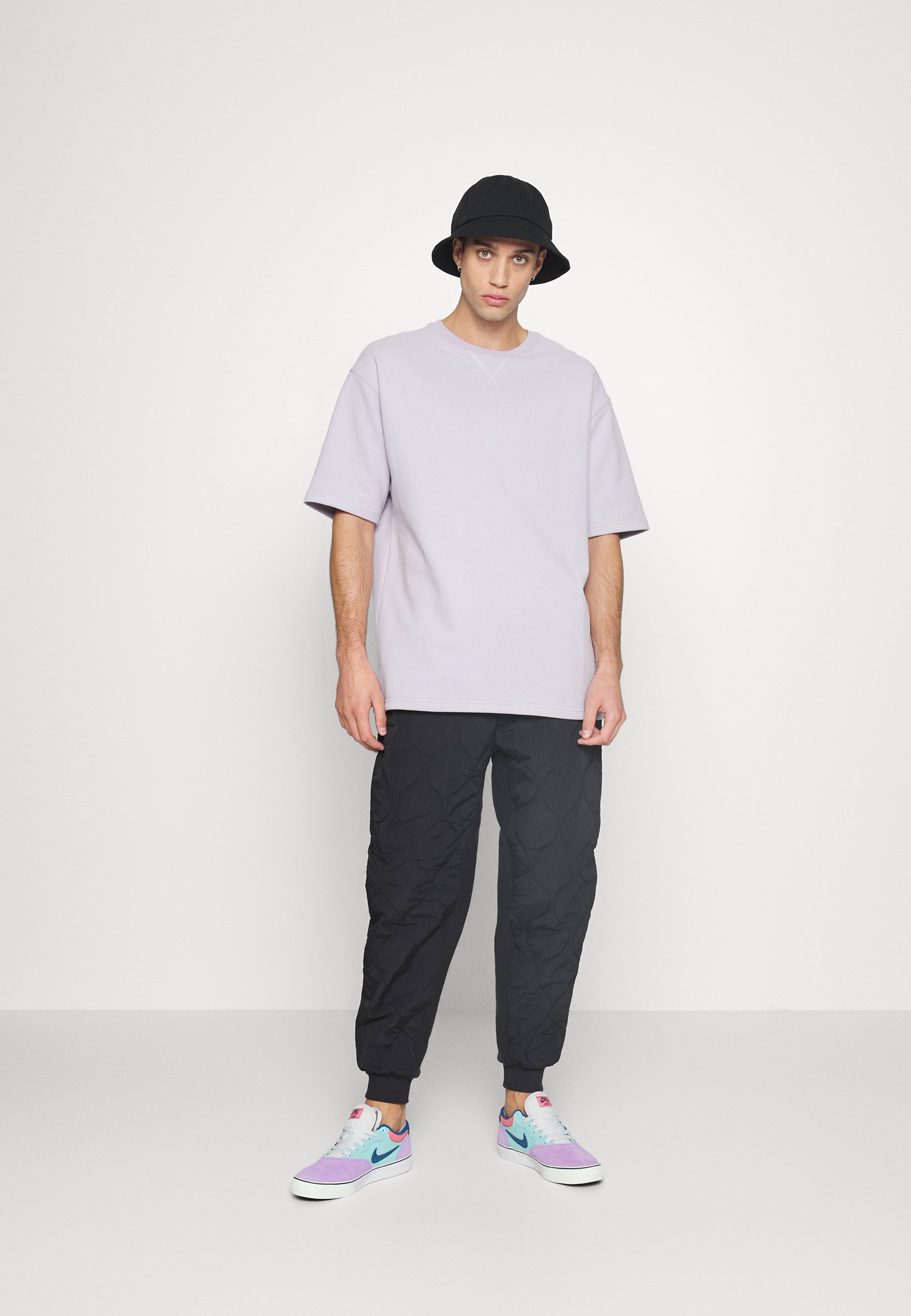 Karl Kani SMALL SIGNATURE QUILTED PANTS UNISEX - Pantaloni - black/nero -  Zalando.it