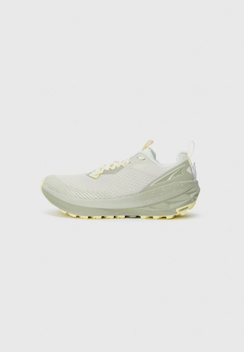 Light green and beige running shoe with textured sole, mesh upper, and pull tab at heel, positioned in profile against white background.
