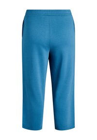 Blaue Jogginghose aus weichem Stoff. Mit elastischem Bund und zwei seitlichen Taschen. Verkürzte Länge, schlichtes Design ohne sichtbare Muster.