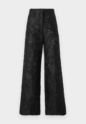 Wide-leg black trousers made of textured fabric with a floral pattern. Features a high waist and a smooth finish.