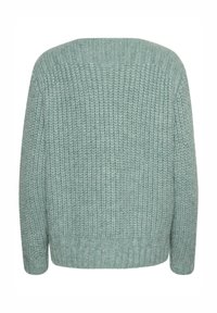 Mėtinio žaliai megzta švarkas su struktūriniu raštu, turintis laisvą pjūvį ir plačias rankoves, baigtas su raukšlėtu pakraščiu.