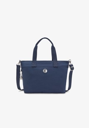 Navy blue tote bag with two handles, adjustable shoulder strap, front logo emblem, and silver charm detail. Textured, durable fabric.