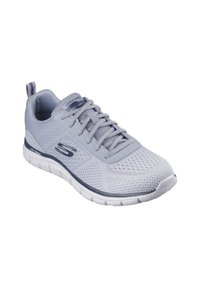 Chaussure de sport gris clair avec tige en maille, fermeture à lacets, semelle rembourrée et accents bleu marine ; conçue pour le confort et la respirabilité.