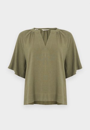 Haut kaki à manches courtes avec col en V et détails plissés. Confectionné dans un tissu texturé, avec une coupe ample et décontractée.