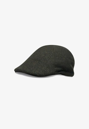 Flat cap in dark green textured wool, featuring a rounded crown and a short, stiff brim. Seam detailing along the sides.