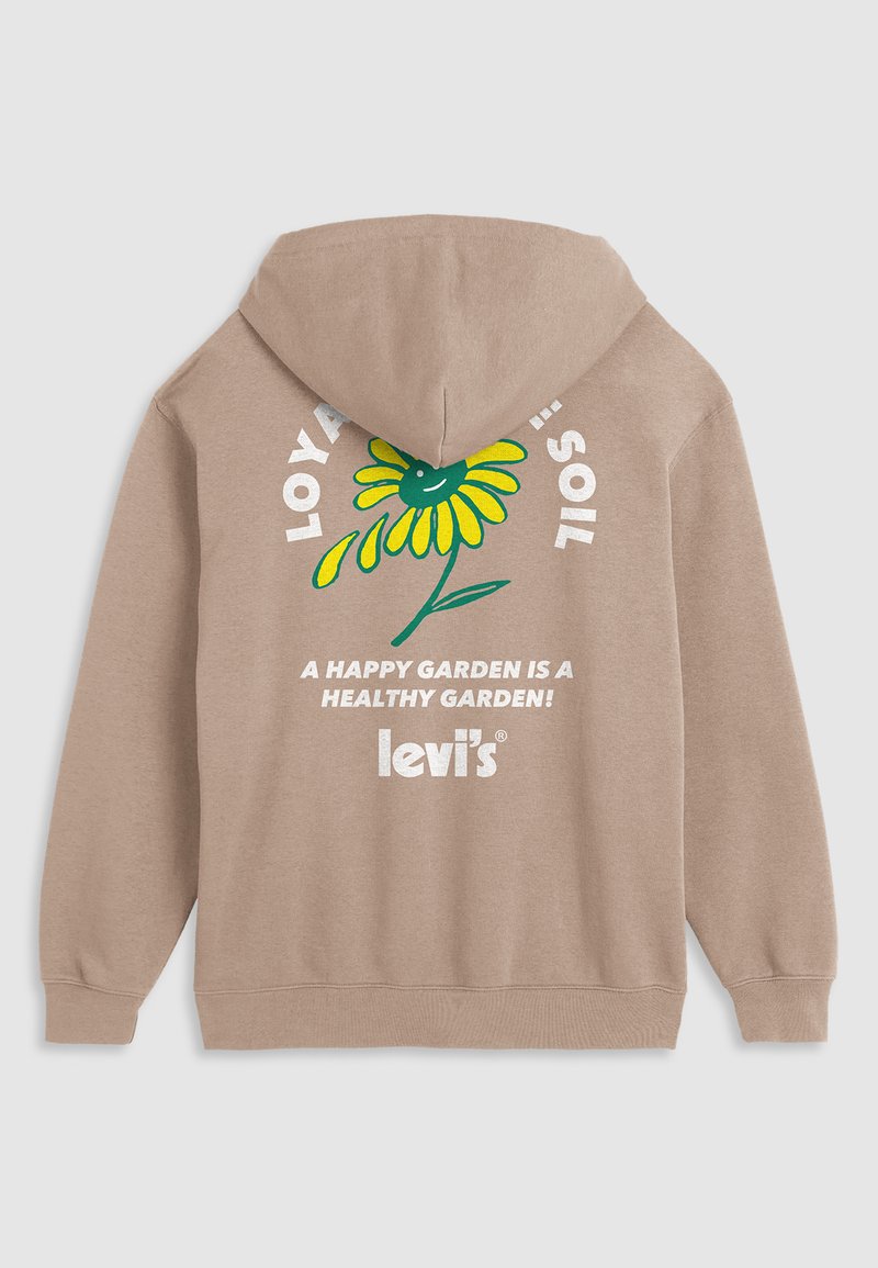 Hoodie marron avec un design de fleurs colorées et le texte "LOVING SOIL" en lettres blanches, avec "UN JARDIN HEUREUX EST UN JARDIN SAIN !" en dessous.