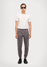 EA7 Emporio Armani TRAIN CORE PANTS - Spodnji deli trenirk - volcanic glass