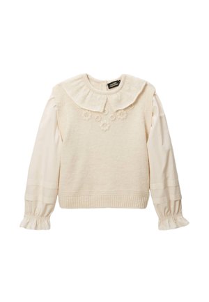 Pull crème avec un corps en tricot texturé, un col à volants et des broderies de fleurs. Comprend des manches longues blanches bouffantes avec des poignets à volants.