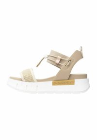 Beige platform sandals with mesh accents, elastic strap, and white sole. Features metallic logo and smooth texture.