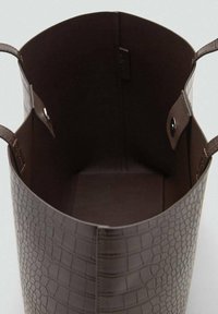 Brown faux leather bag with a textured crocodile pattern, open top, and two handles. Interior features a smooth, dark brown lining.