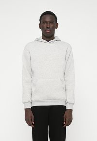 Gray sweatshirt with a hood and front pocket, featuring a soft texture and ribbed cuffs at the wrists and hem.