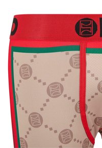 Boxer-briefs pour hommes avec une ceinture élastique rouge, arborant un fond beige avec un motif géométrique de cercles et de carrés marron.