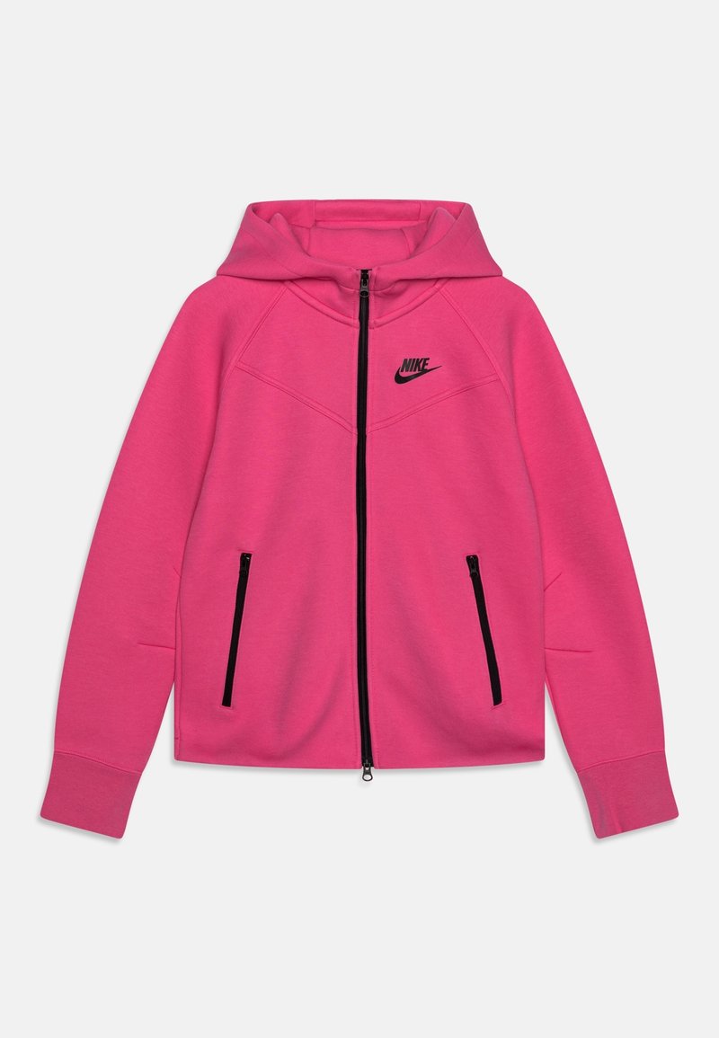 Růžová mikina na zip s kapucí, černým zipem a černým logem Nike na hrudi. Obsahuje dvě přední kapsy na zip a žebrované manžety.
