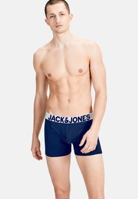 Navy blue boxer briefs with a white elastic waistband featuring "JACK & JONES" logo, made from a smooth, stretchy fabric.