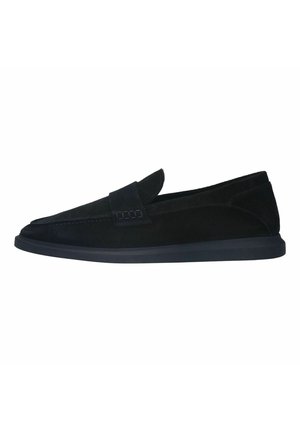 Black suede slip-on shoes with a tapered design, stitched detailing, and a navy rubber sole. Features a decorative strap across the upper.