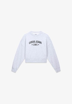 Felpa grigia corta in tessuto morbido, con testo ricamato nero "GUESS JEANS 1981" e maniche raglan.