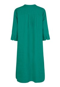 Teal linnedrakt med en afslappet pasform, rund halsudskæring og trekvartlange ærmer. Har bagfold og sideslids for nem bevægelse.