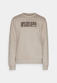 Felpa beige con un grande graphic "raw" marrone scuro e testo "G-Star" sul davanti; colletto e polsini a coste.