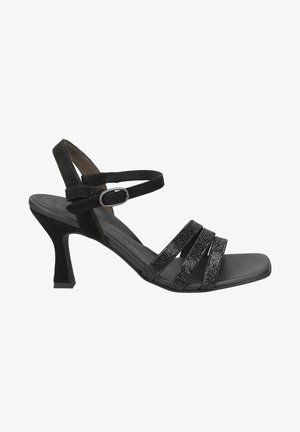 Black high-heeled sandal with a tapered block heel, featuring multiple glittery straps and a slim ankle strap with a buckle.