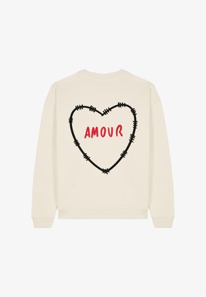 Sweatshirt color crema con un grande cuore contornato di nero e la parola "AMOUR" in rosso, posizionata in modo prominente sul retro.