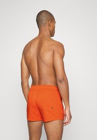 Puma SWIM MEN - Fürdőnadrág - chili powder