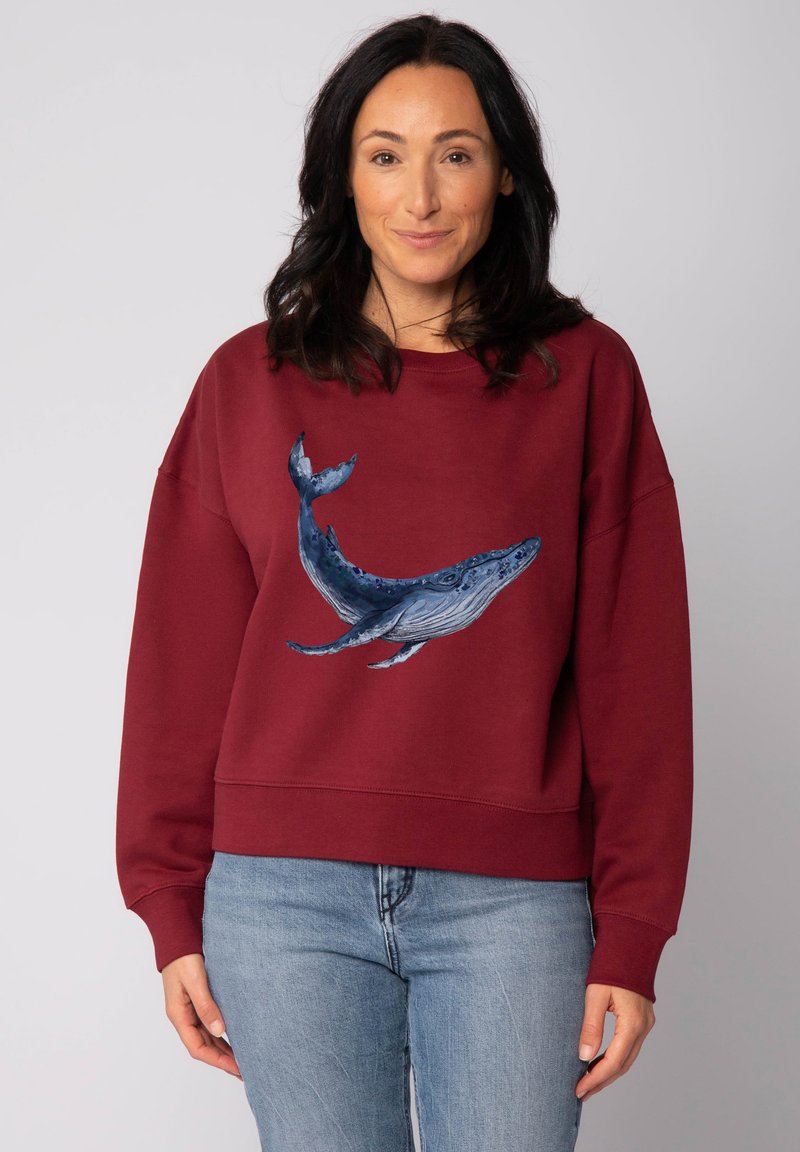 Bordeaux sweatshirt met een afbeelding van een blauwe walvis aan de voorkant. Gemaakt van katoen met een relaxte pasvorm en geribde boorden, ontworpen voor comfort.