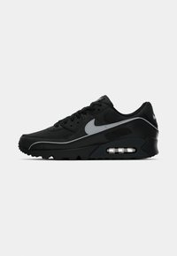 Sneakers Nike Air Max 90 neri con accentuazioni grigie. Presentano un tessuto testurizzato, un collare imbottito e un'ammortizzazione ad aria visibile nella suola.