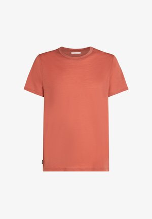 Kortærmet t-shirt i ferskenfarve, lavet af blødt stof. Rund halsudskæring, lige snit, med et lille sideetiket til branding.