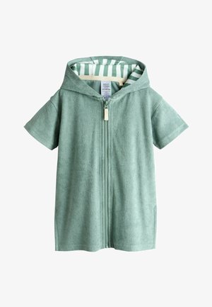 Ręcznik dla małego dziecka z kapturem na krótki rękaw w jasnym zielonym kolorze, z przednim zamkiem błyskawicznym i podszyciem w paski wewnątrz kaptura, rozmiar 12-18 miesięcy.