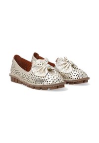 Metallic gold perforated flats with a knotted bow detail on the toe. Durable rubber sole with textured grip. Soft leather interior.