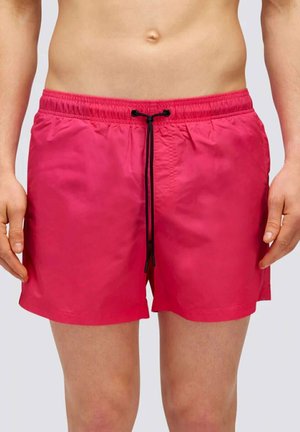 Pantaloni da bagno rosa realizzati in materiale leggero con vita elastica e cordino nero. Presentano un design semplice e una linea dritta.