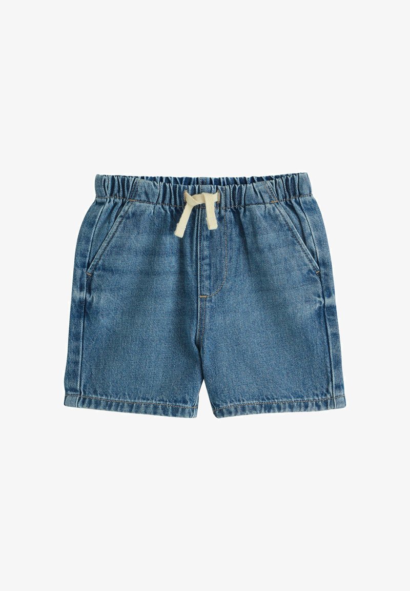 Džinsiniai šortai vidutinės mėlynos spalvos su elastine juosmens juosta ir dramblio kaulo spalvos raišteliu. Yra dvi šoninės kišenės ir tiesus kirpimas.