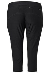 Czarne sportowe spodnie capri wykonane z lekkiego, elastycznego materiału. Posiadają małą kieszeń na zamek z tyłu oraz kontrastowe przeszycia.