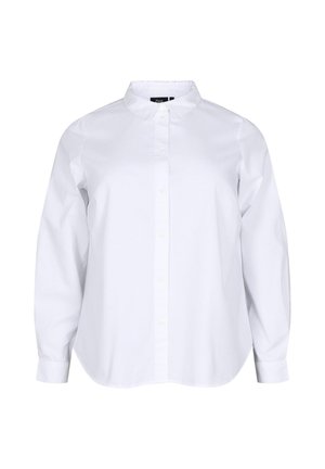 Chemise blanche à col rabattu en coton. Présente de longues manches amples et un ourlet arrondi. Design classique à boutons avec une texture lisse.