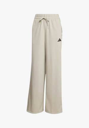 Pantaloni beige a gamba larga in felpa con vita elastica, coulisse e logo Adidas nero sulla coscia destra.