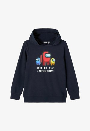 Sudadera azul marino con un gráfico de cuatro personajes coloridos, con el texto "¿QUIÉN ES EL IMPOSTOR?" en negrita blanca. Material de algodón.