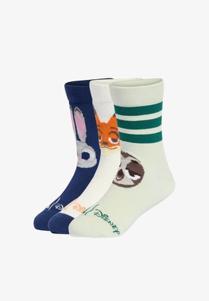 Tre calzini colorati alla caviglia con personaggi: un calzino blu con un coniglio, un calzino bianco con una volpe e un calzino verde chiaro con un bradipo.
