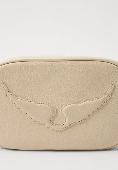 Beige leather bag with a textured surface and embossed wing design. Rounded shape, subtle stitching details, and smooth finish.