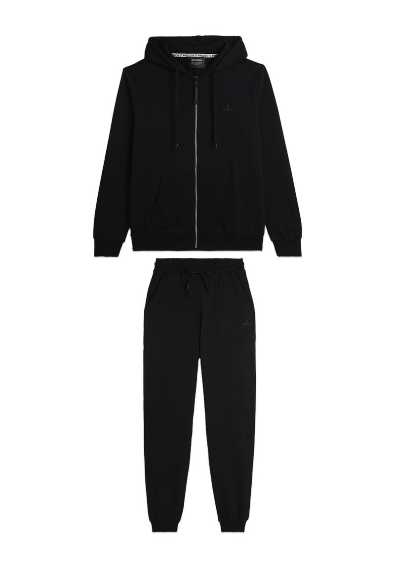 Sudadera con cremallera negra y pantalones de chándal a juego. Tejido suave, cintura con cordón, piernas ajustadas, branding mínimo visible.