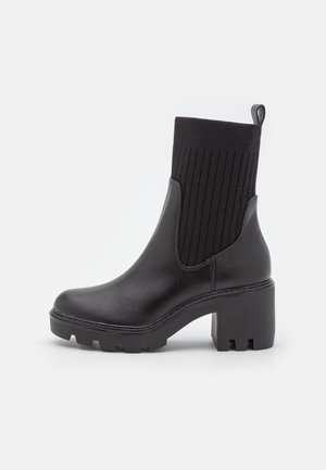 Platform ankle boots - black