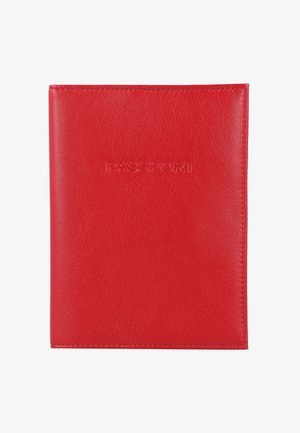 Red leather passport cover with embossed "PASSPORT" text centered on the front, stitched edges, and a smooth texture.