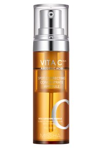 Ampoule en verre ambre avec un bouchon en métal argenté et un capuchon en plastique transparent. L'étiquette indique « VITA C PLUS » et « CONCENTRÉ CORRECTEUR DE TACHES ».}}}]}