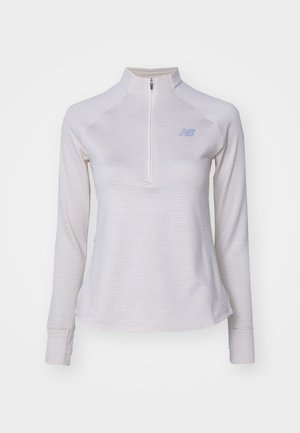 New Balance ATHLETICS GRID 1/2 ZIP - Pikkade varrukatega topp - beige